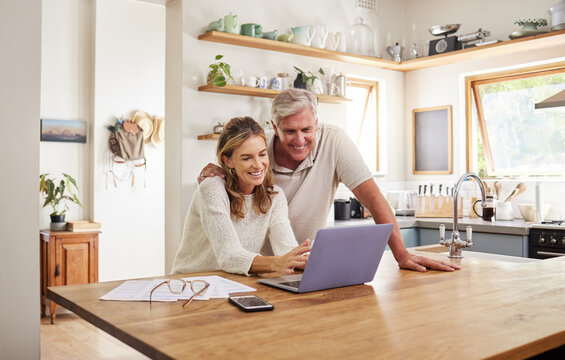 Happy couple budget, laptop finance and tax while planning investment, loan and paperwork bills in home kitchen. Mature man, smile woman and online banking technology, ecommerce and retirement admin