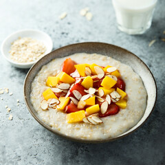 Homemade oatmeal porridge with strawberry and mango