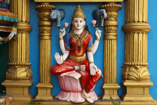 Lakshmi is the Goddess of prosperity and wealth in Hinduism. The four-armed goddess sits on a lotus flower with a blessing gesture.