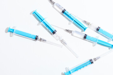 Fototapeta premium Disposable plastic syringe prepared for injection and vaccination in the hospital. The concept of medicine and health