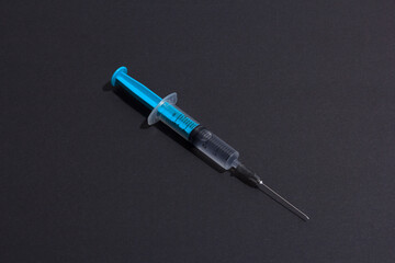 Disposable plastic syringe prepared for injection and vaccination in the hospital. The concept of medicine and health