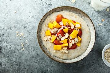 Homemade oatmeal porridge with strawberry and mango