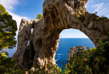 “Arco Naturale“ is a natural limestone arch that forms a bridge between two pillars of rock. It...
