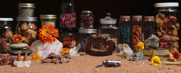 Agatized Coral With Quartz Crystals and Flowers With Australian Red Sand on Meditation Table