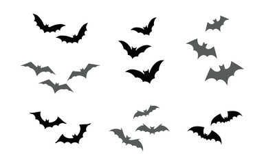Obraz na płótnie Canvas Set flying bats silhouette, isolated on white background. Vector illustration, traditional Halloween decorative elements. Halloween silhouette cute bats - for scary design and decor.