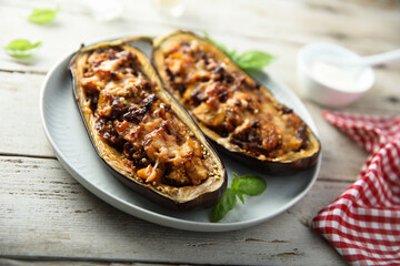 Stuffed roasted eggplant with meat and cheese