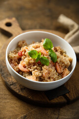 Healthy quinoa bowl with shrimps and basil