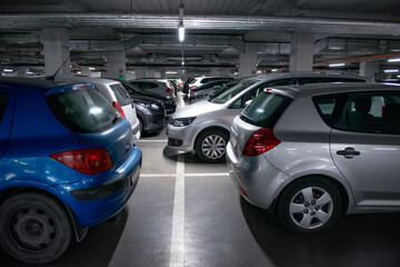 Fototapeta na wymiar View of different cars in underground parking