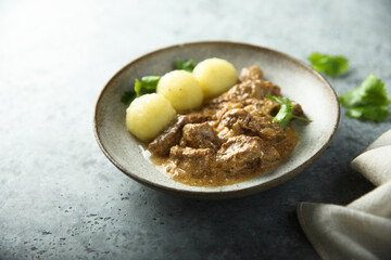 Homemade beef ragout with potato dumplings