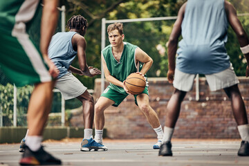Basketball, team sport and competition for male athletes and players in training or professional match on an outdoor fitness court. Diversity, competitive and skill of men playing a ball game in USA - Powered by Adobe