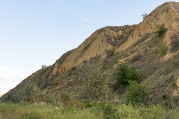 Fototapeta na wymiar Sand hill slope. Landscapes of Moldova. Sand hills are located near the Prut River in the Cahul region, Moldova