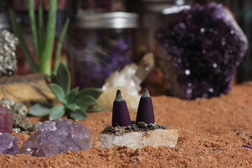 Amethyst Crystals and Chakra Stones on Australian Red Sand. Meditation Table