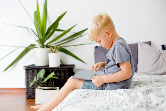 Blondy Boy Spend Your Leisure Time With Tablet At Home