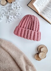 Fashionable knitted hats autumn-winter. The hat lies on a white background. Product layout. Buy a hat. Knitting. Hobby.
