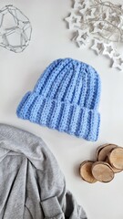 Fashionable knitted hats autumn-winter. The hat lies on a white background. Product layout. Buy a hat. Knitting. Hobby.