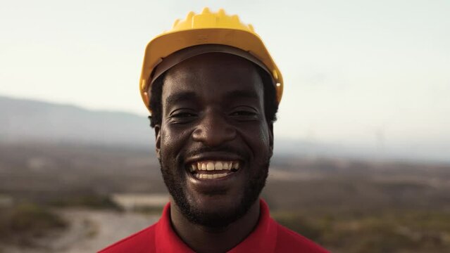 Young African builder working on construction site