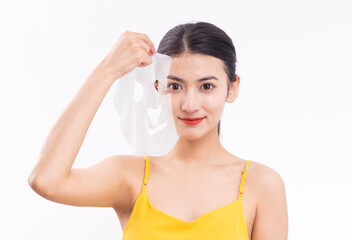 A young woman wearing a facial mask against a white background