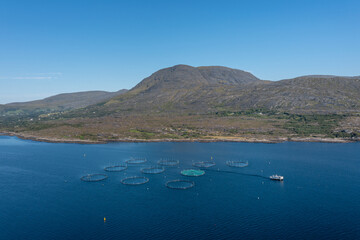 aerial view of a salmon fish farm in Bantry Bay in County Cork of western Ireland