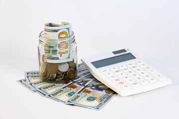 Donation concept. Donation jar with coins, calculator dollars and wooden letters