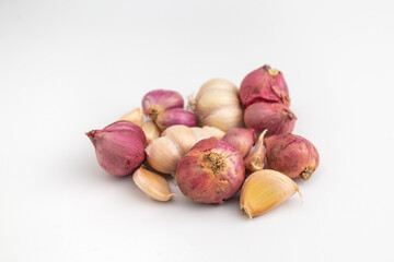 raw garlic and shallot isolated on white background