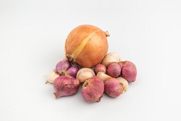 raw garlic and shallot and onion with the skin isolated on white background