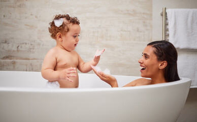 Mother, baby and bath in bathroom home, health and cleaning. Mom, parent and child or kid bathing...