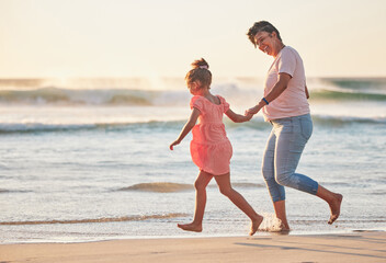 Family, child and grandma running on beach vacation having fun, energy and adventure with mature and girl holding hands on tropical summer trip. Active grandparent and happy kid traveling by the sea