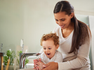 Mother, boy and washing hands help in water as fun covid bacteria cleaning and morning house...