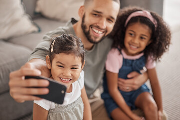 Love, father and children selfie on smartphone for cute bonding memory together in living room. Social media photograph of Mexican dad and young children relaxing in family home on weekend.