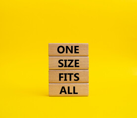 One size fits all symbol. Concept words One size fits all on wooden blocks. Beautiful yellow...