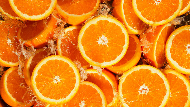 Freeze Motion Shot of Splashing Fresh Oranges, Close-up.