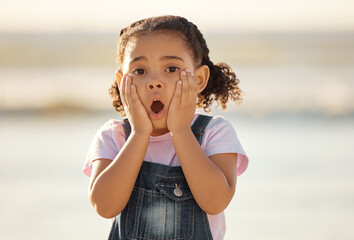 Wow, children and hands on the face of a girl on the beach looking surprised or shocked outside...