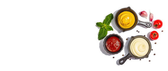 Set of sauces and fresh vegetables isolated on white background. Mustard, ketchup and mayonnaise