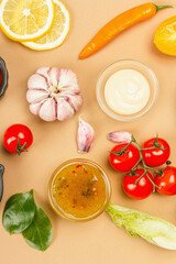 Set of sauces isolated on beige background. Ketchup, mustard, mayonnaise, wasabi, sweet curry