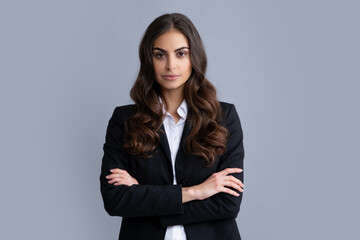 Portrait of successful business woman in suit on gray isolated background. Serious office female worker, manager employees.