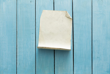 old paper on blue wall