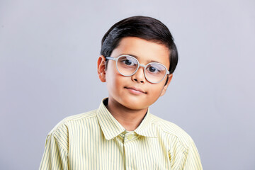 Indian school boy in uniform and giving expression.