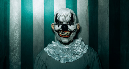 Fototapeta creepy evil clown in the old circus, banner obraz