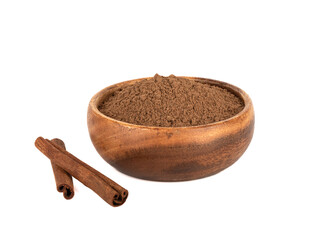 Cinnamon sticks and ground cinnamon on a white background.