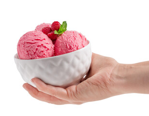 Hand holding bowl with three scoops of sweet homemade organic berry pink ice cream or sorbet made of raspberry decorated with fresh green mint leaf isolated on white background used as dessert
