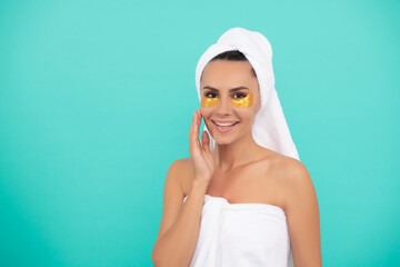 young woman in shower towel with collagen patch