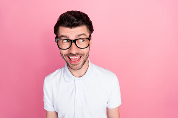 Closeup photo of young attractive positive excited nice man wear eyeglasses good mood look empty space deal offer isolated on bright pink color background