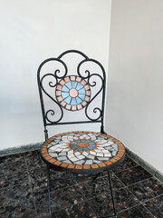 Antique furniture mosaic chair in vintage style.
