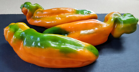 Сolorful sweet pepper, paprika on grey background
