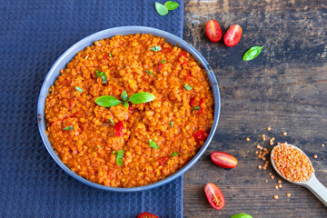 Red lentil dish with tomatoes and peppers. Vegetarian cooking