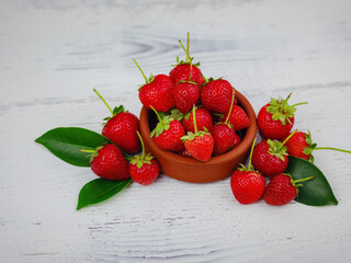 Fresh organic strawberries , over white background. Vegetarian healthy food concept.