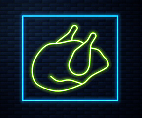 Glowing neon line Roasted turkey or chicken icon isolated on brick wall background. Vector