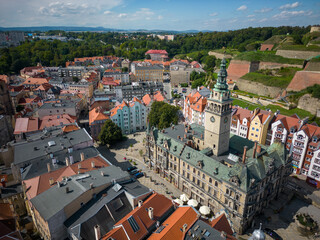 Kłodzko - a city situated in the mountains. Sunny day and clouds in the blue sky in the mountains.