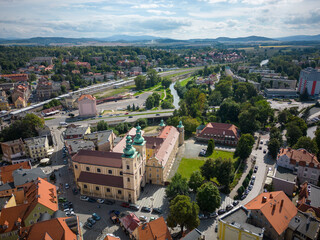 Kłodzko - a city situated in the mountains. Sunny day and clouds in the blue sky in the mountains. - obrazy, fototapety, plakaty
