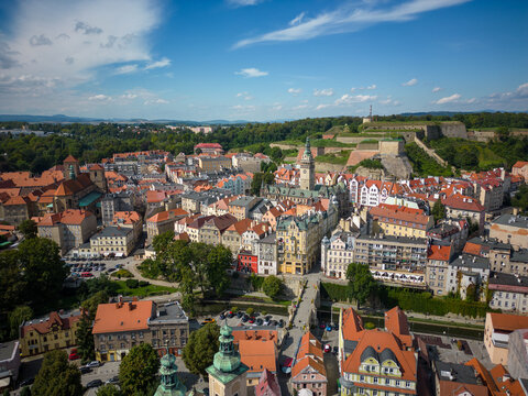 Kłodzko - a city situated in the mountains. Sunny day and clouds in the blue sky in the mountains.
